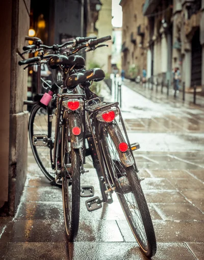 Parked Bicycles On A Rainy European Street