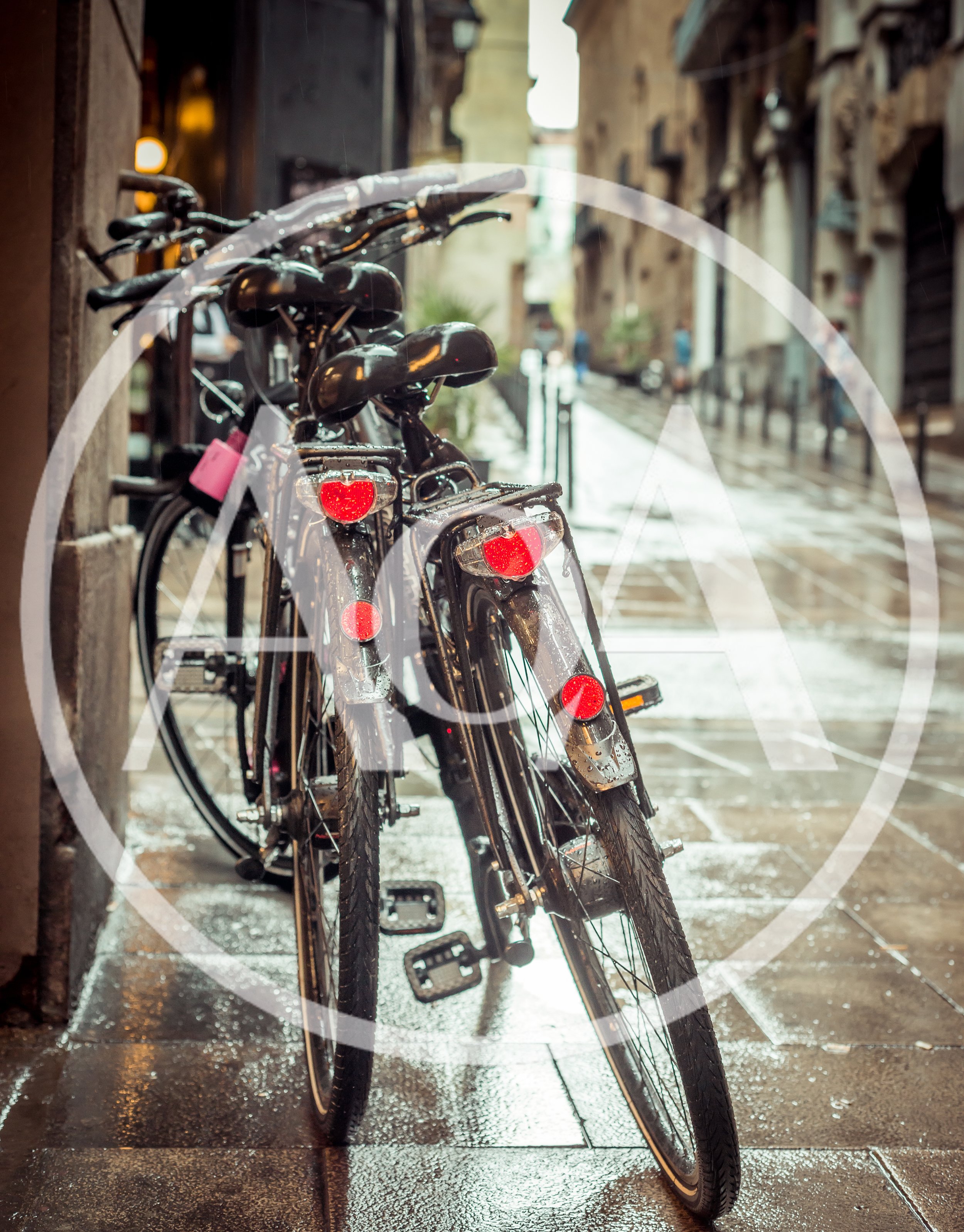 Parked Bicycles On A Rainy European Street