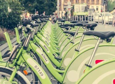 Row Of Lime Green Public Rental Bicycles