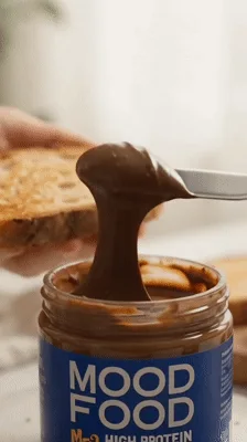 Woman Spreading Chocolate Peanut Butter on Toast