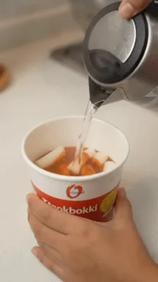 Preparing Instant Tteokbokki In A Cup