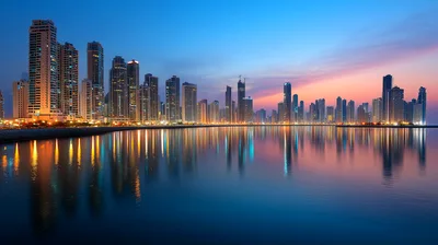 Panoramic Skyline Of Sharjah City At Sunset