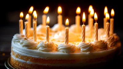 Birthday Cake With Lit Candles In Dark Setting