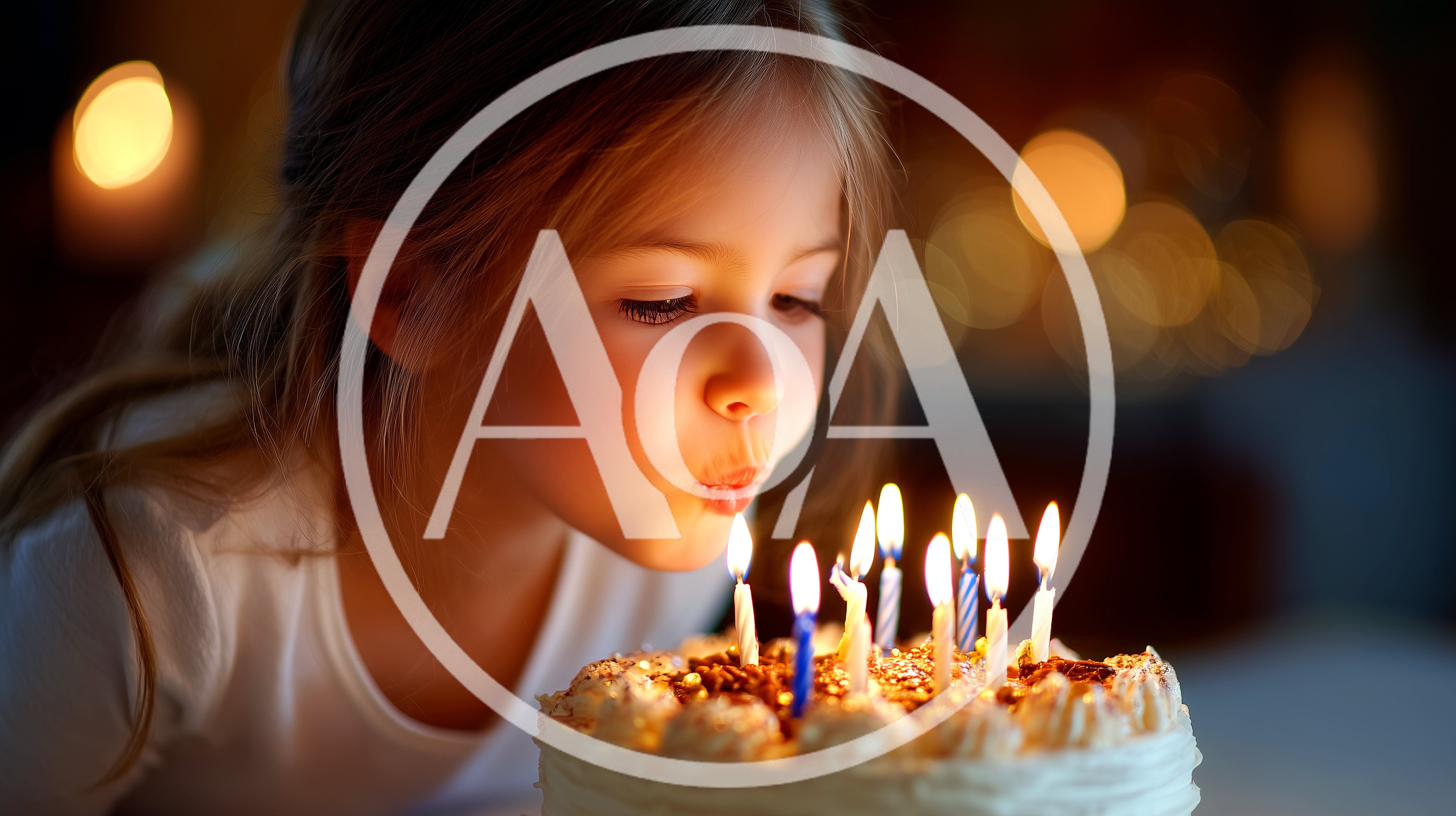 Sweet girl blows out the birthday candles, making a wish on her special day in a warm glowing setting with a delicious cake for celebration