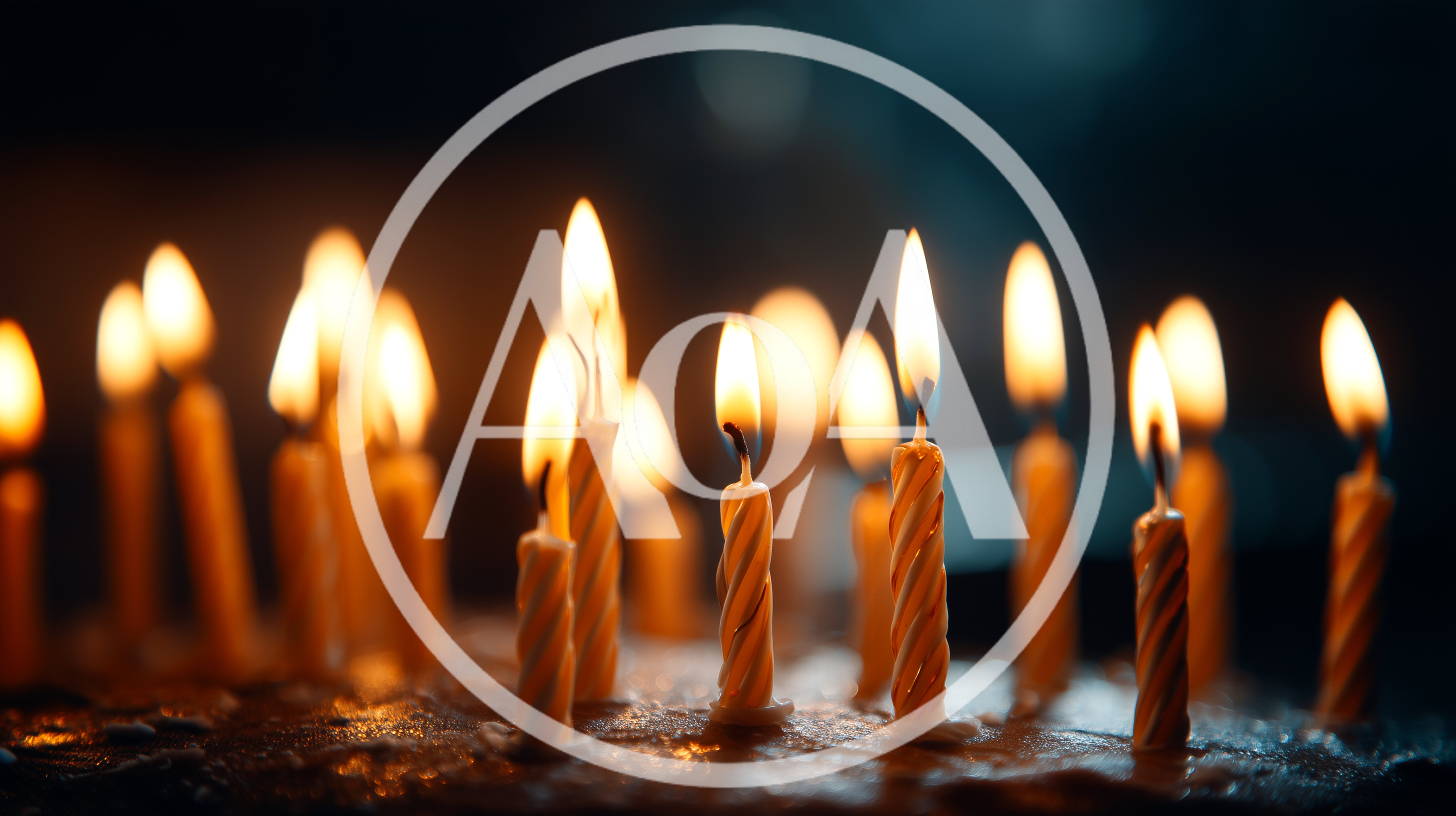 Burning Birthday Candles On A Dark Cake