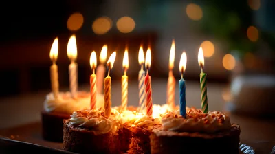 Birthday Cake With Lit Candles On A Table
