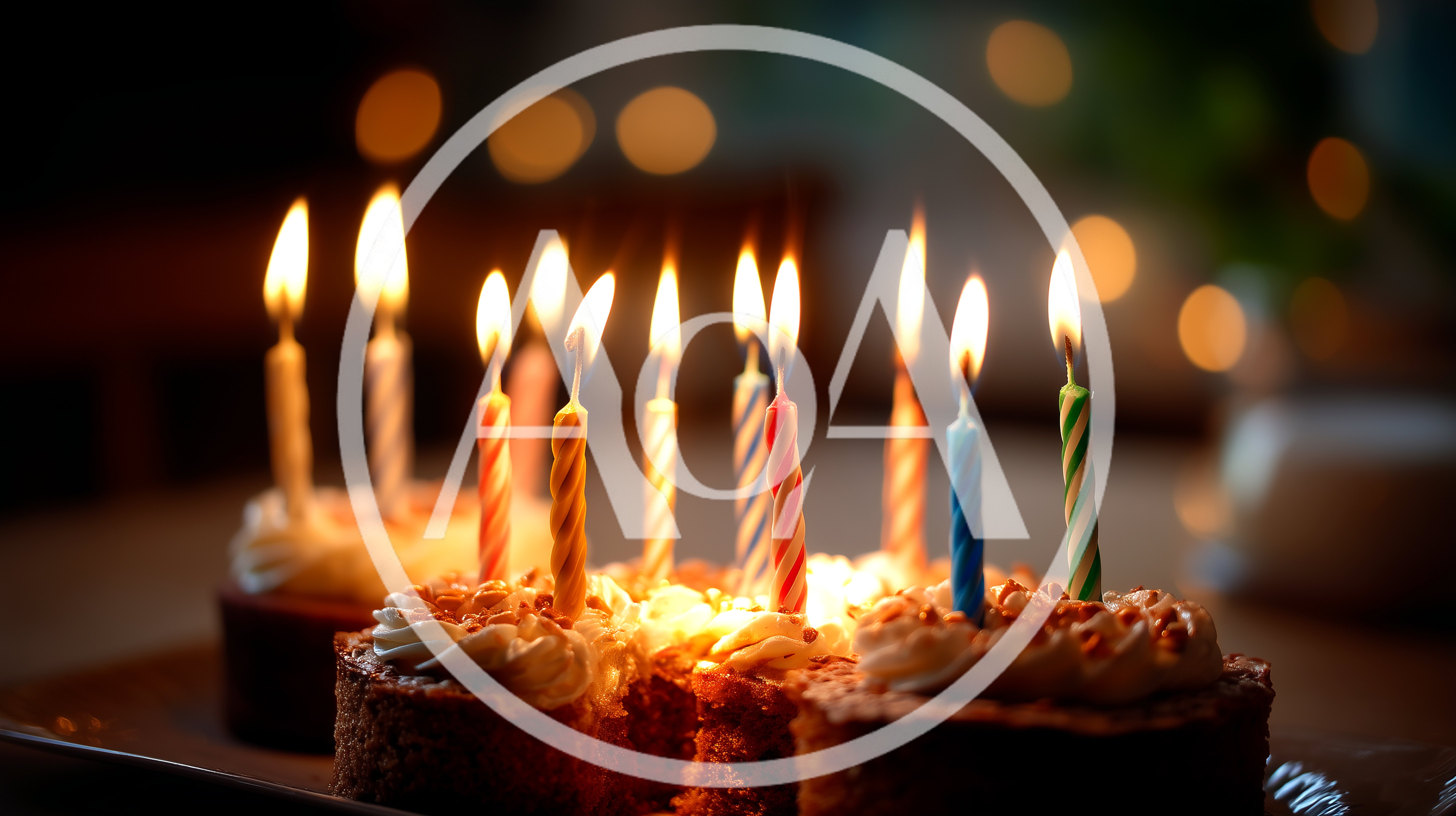 Birthday Cake With Lit Candles On A Table