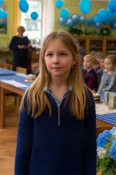 Young Girl Standing in a Decorated Classroom