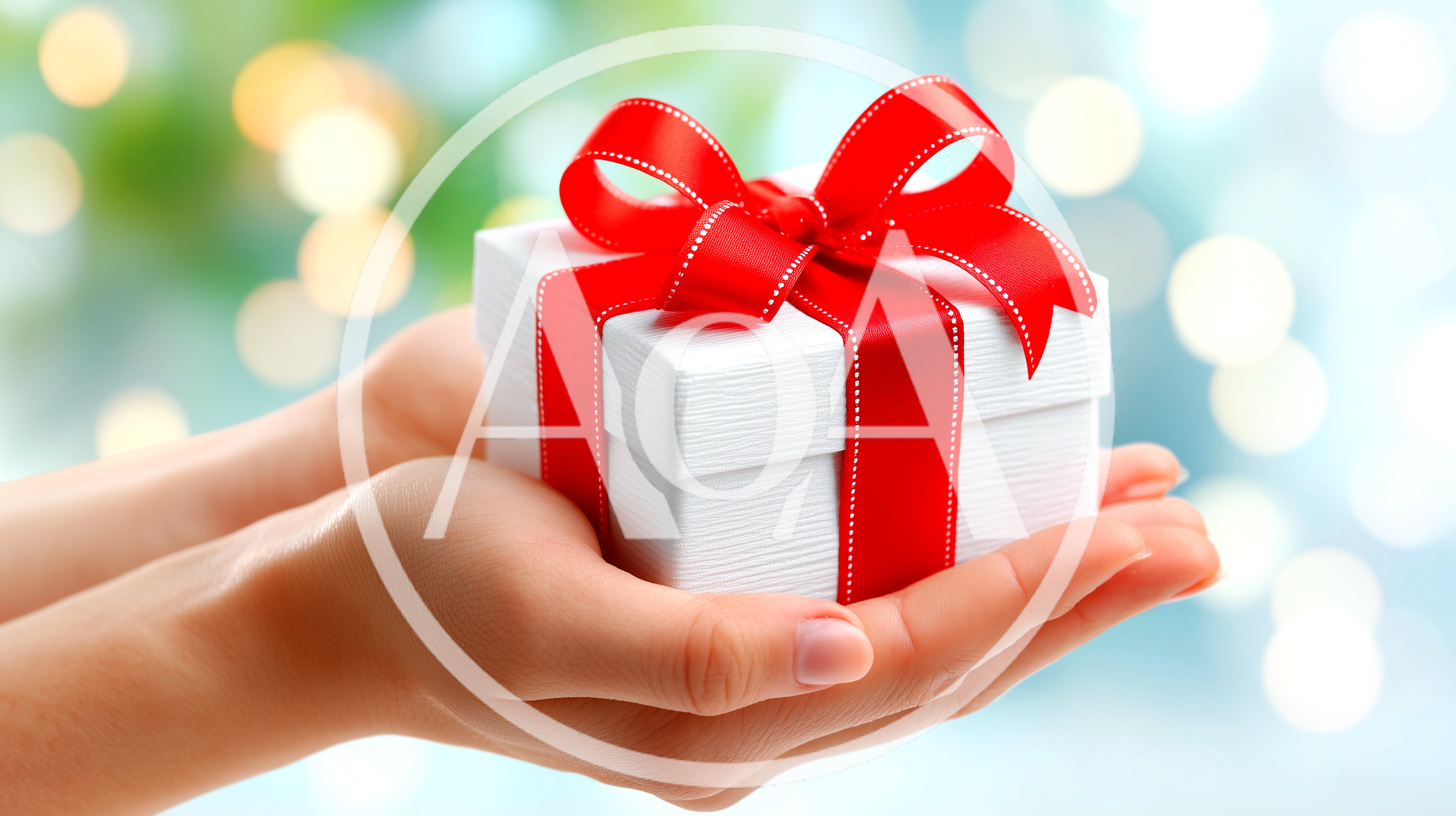 Hands Holding A White Gift Box With Red Ribbon