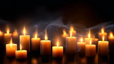Multiple Lit Candles With Wisps Of Smoke