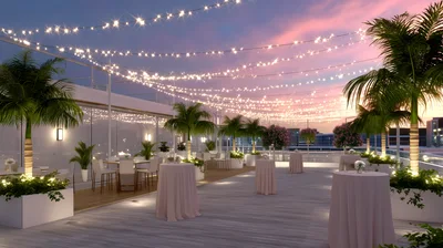 Rooftop Terrace Event Space With String Lights At Sunset