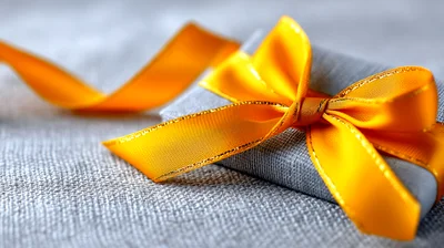 Small Grey Gift Box With Bright Yellow Ribbon