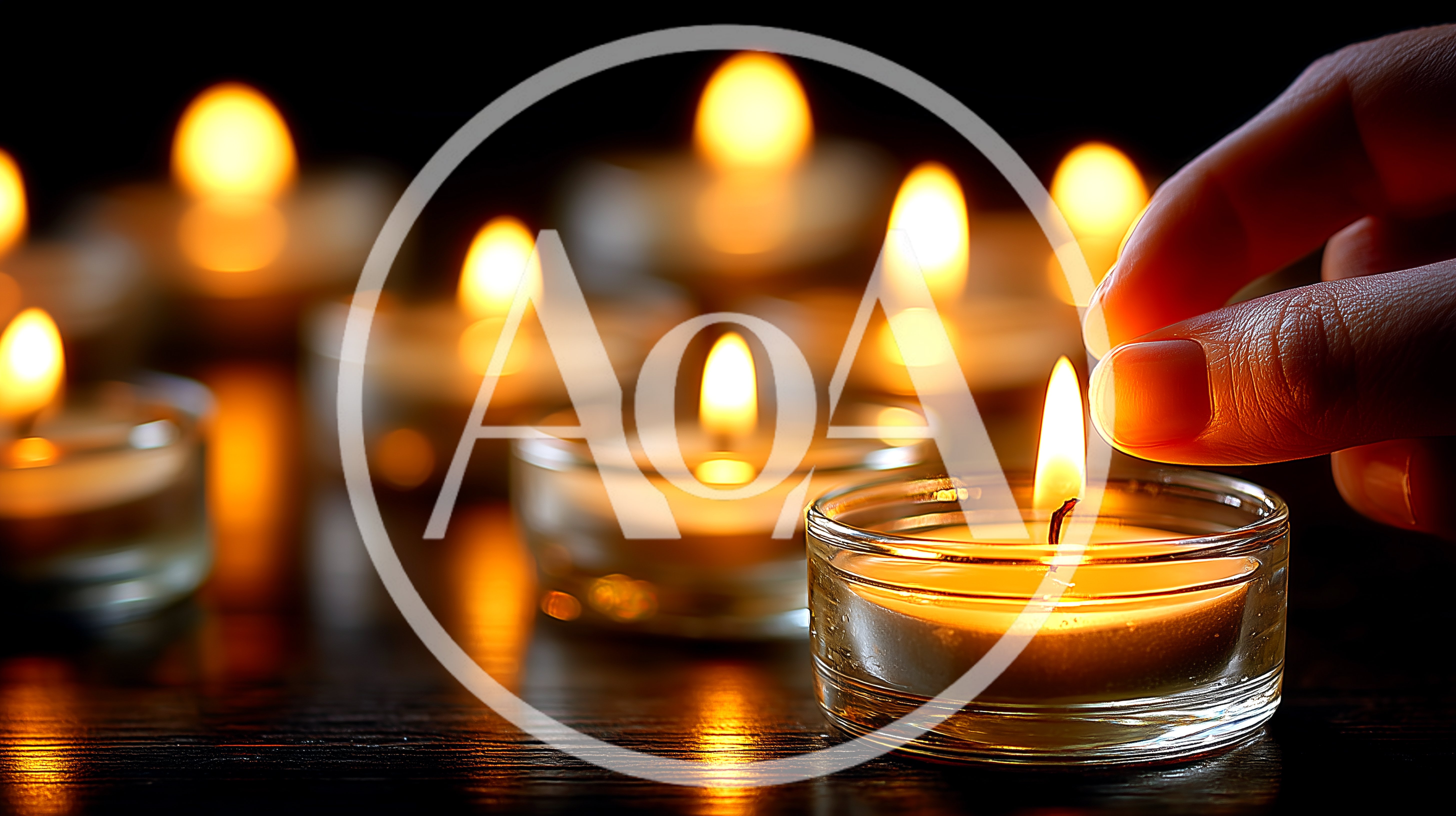 Hand Adjusting A Lit Tea Light Candle