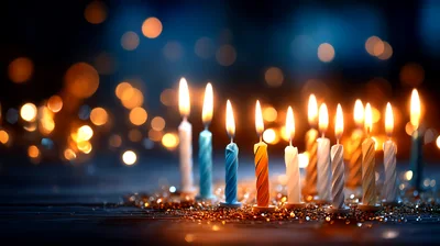 Row Of Lit Birthday Candles With Bokeh Background