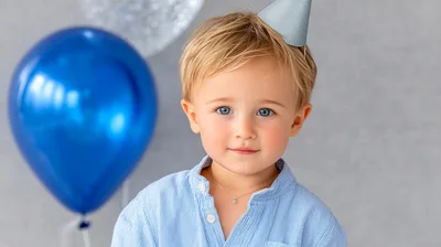 Toddler Boy Wearing A Party Hat
