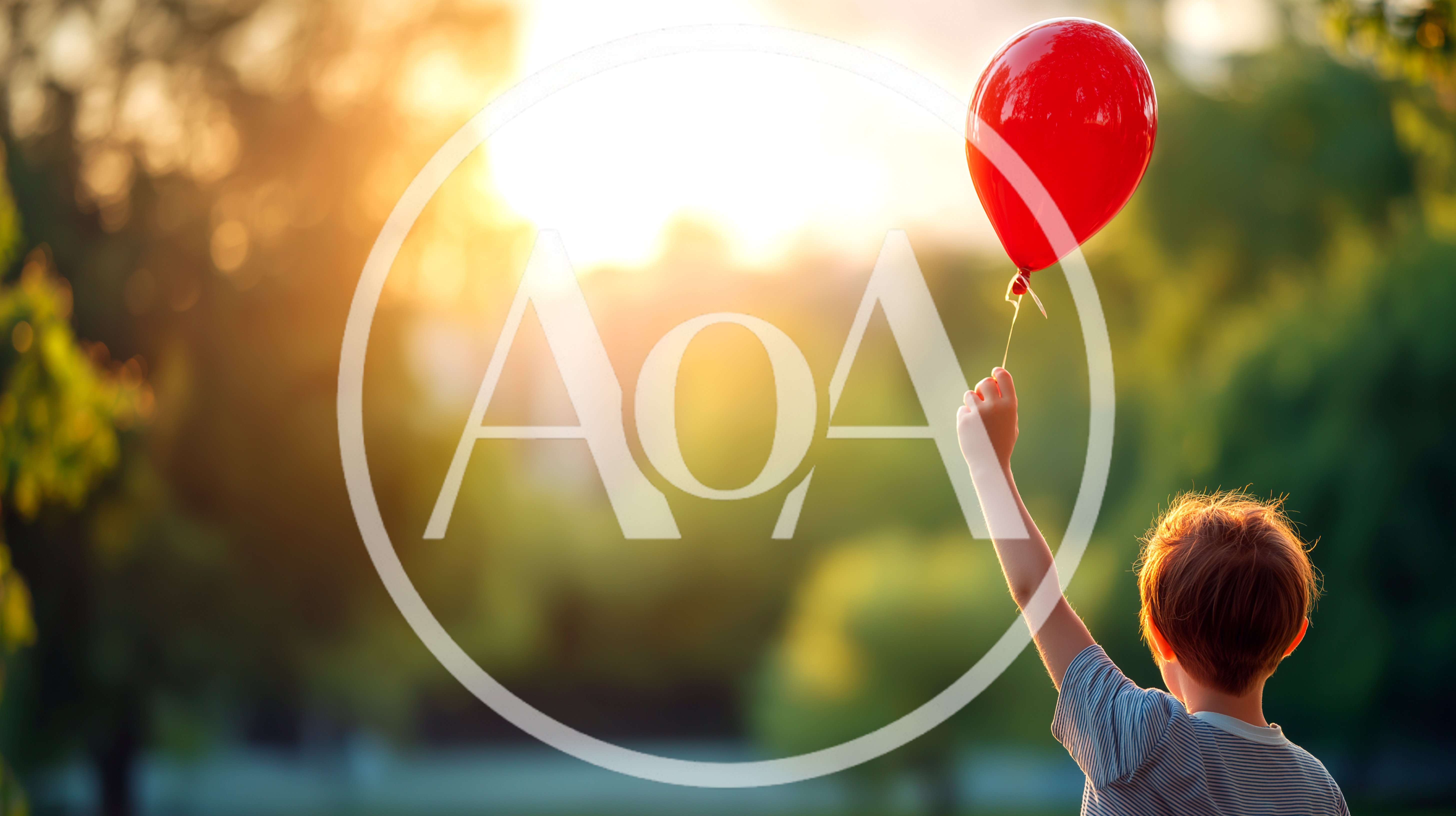 Young Boy Holding A Red Balloon Outdoors