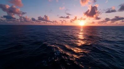 Aerial View Of Ocean Sunset Over Calm Waters