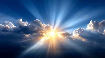 Sunlight Beams Radiating Through Clouds In Blue Sky