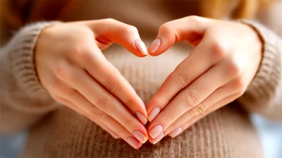 Pregnant Woman Making Heart Shape With Hands
