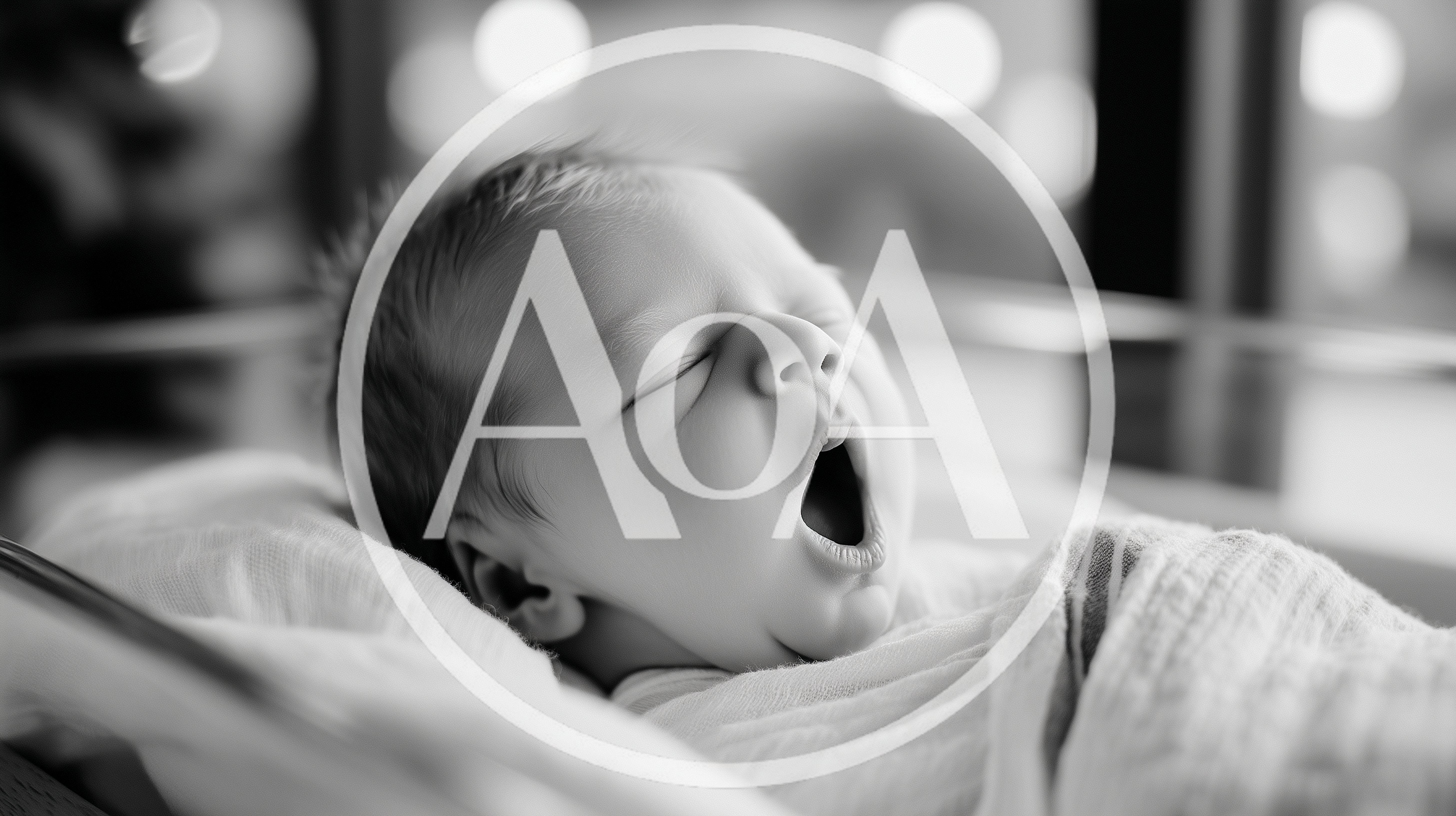 Newborn Baby Yawning While Sleeping In Hospital Bassinet