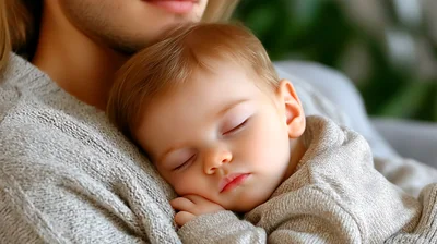 Baby Sleeping Peacefully In Parent Arms