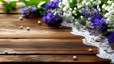 Purple Flowers And White Lace On Rustic Wooden Background