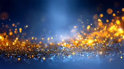 Abstract Golden Glitter Particles On Blue Background