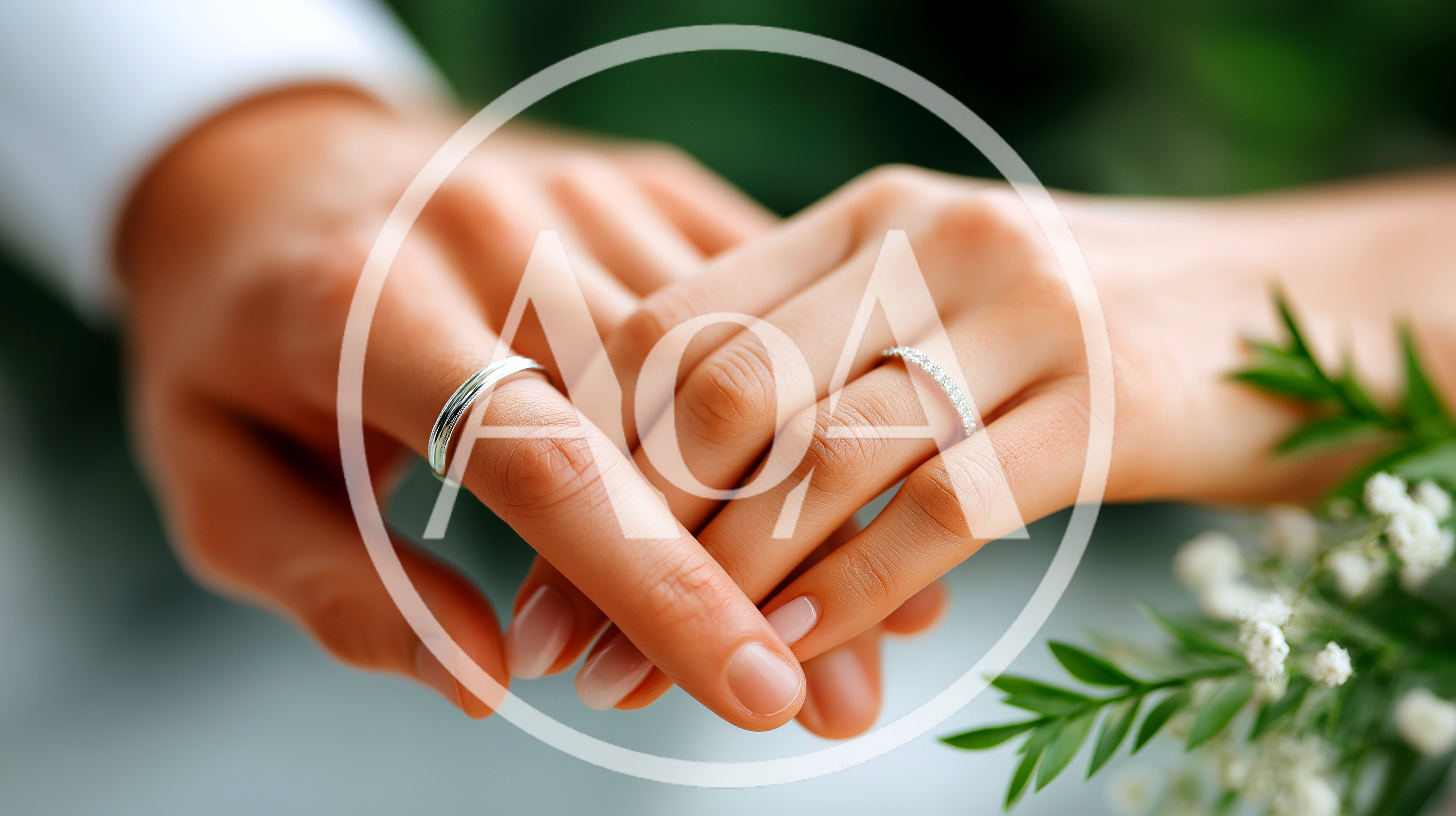 Close Up Of A Couple Holding Hands With Wedding Rings