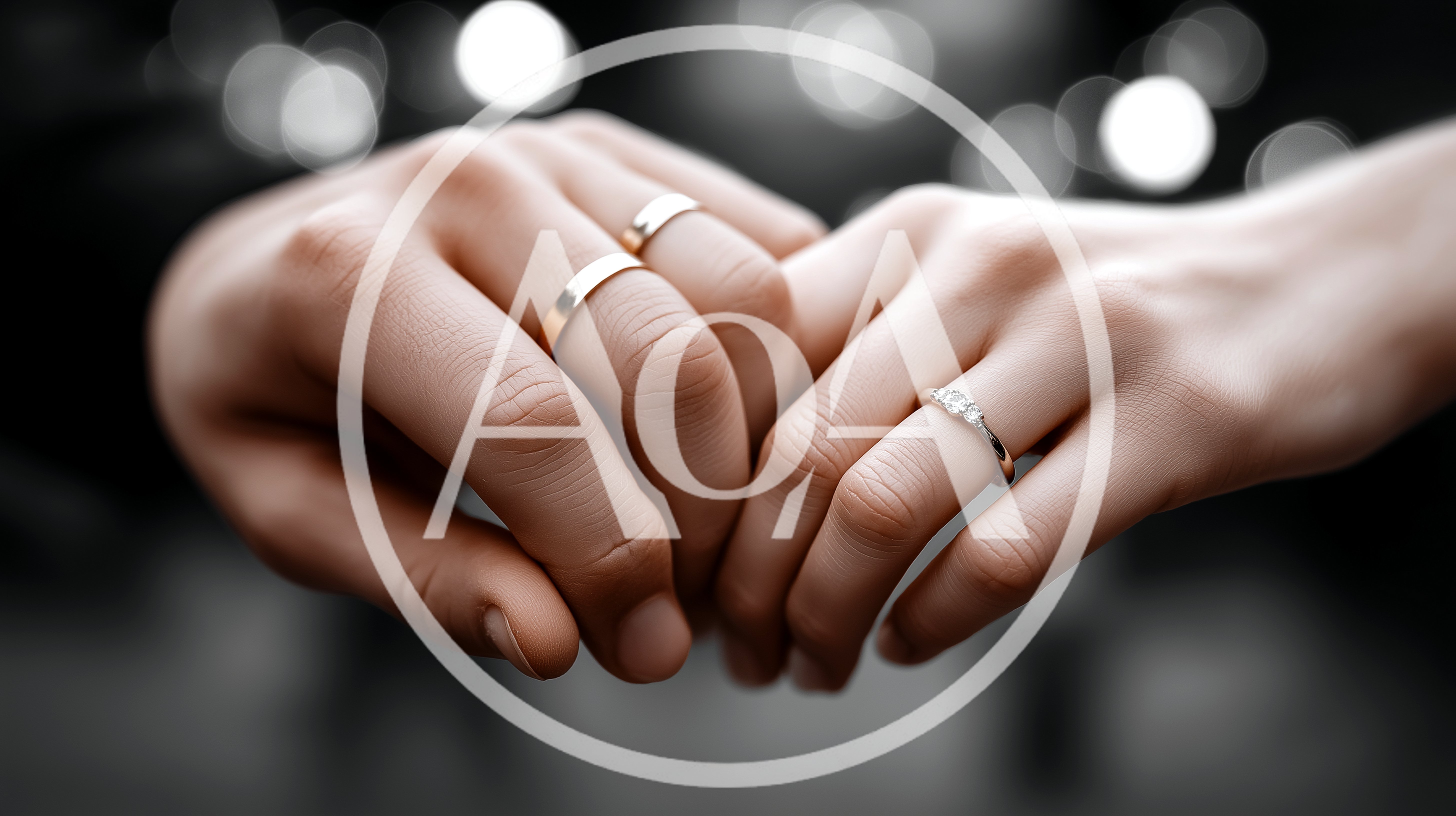 Close Up Of A Couple Holding Hands With Wedding Rings
