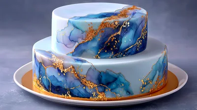 Two Tiered Blue Watercolor Cake With Gold Leaf