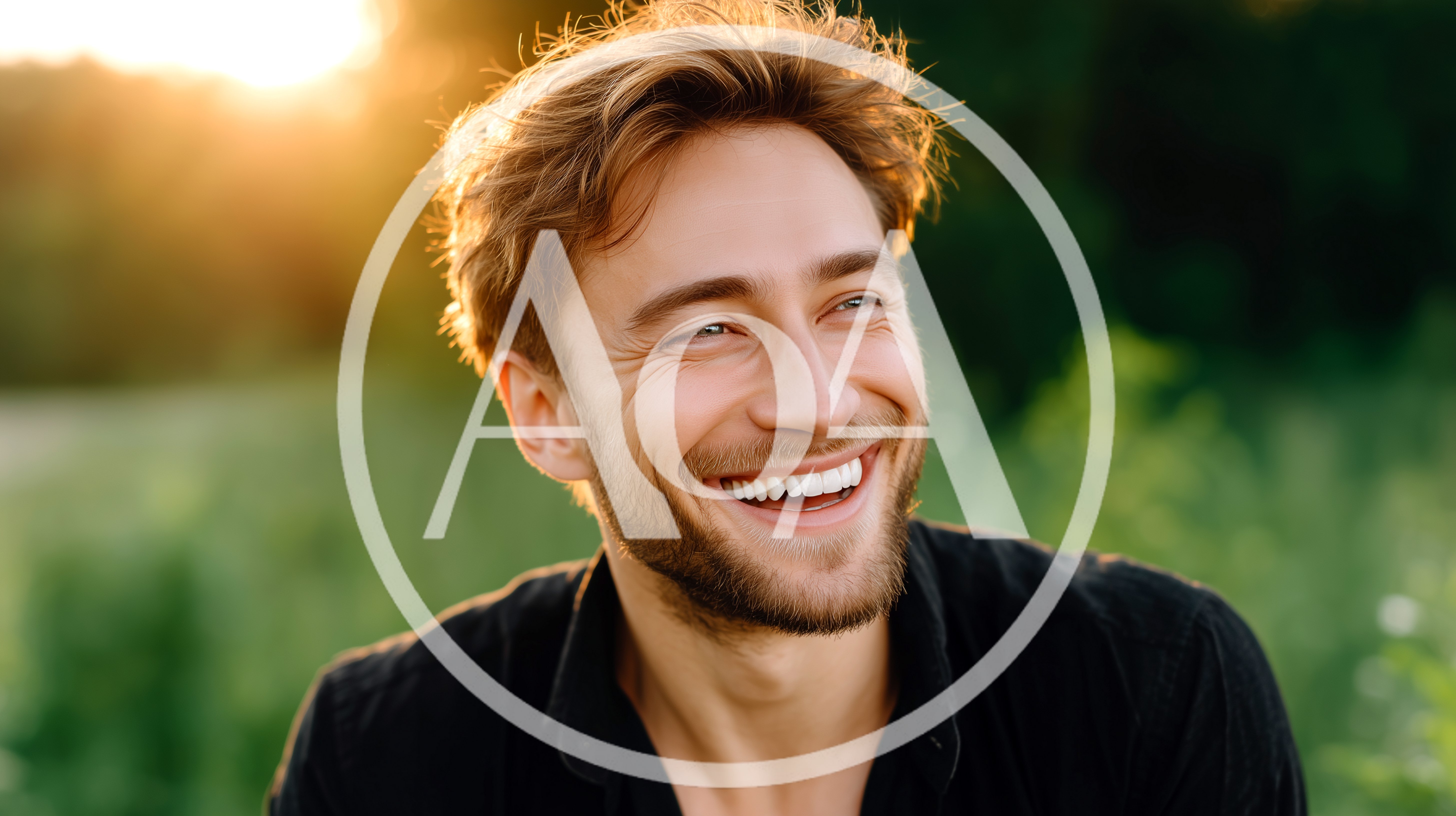 Smiling Man With Stubble Outdoors At Sunset