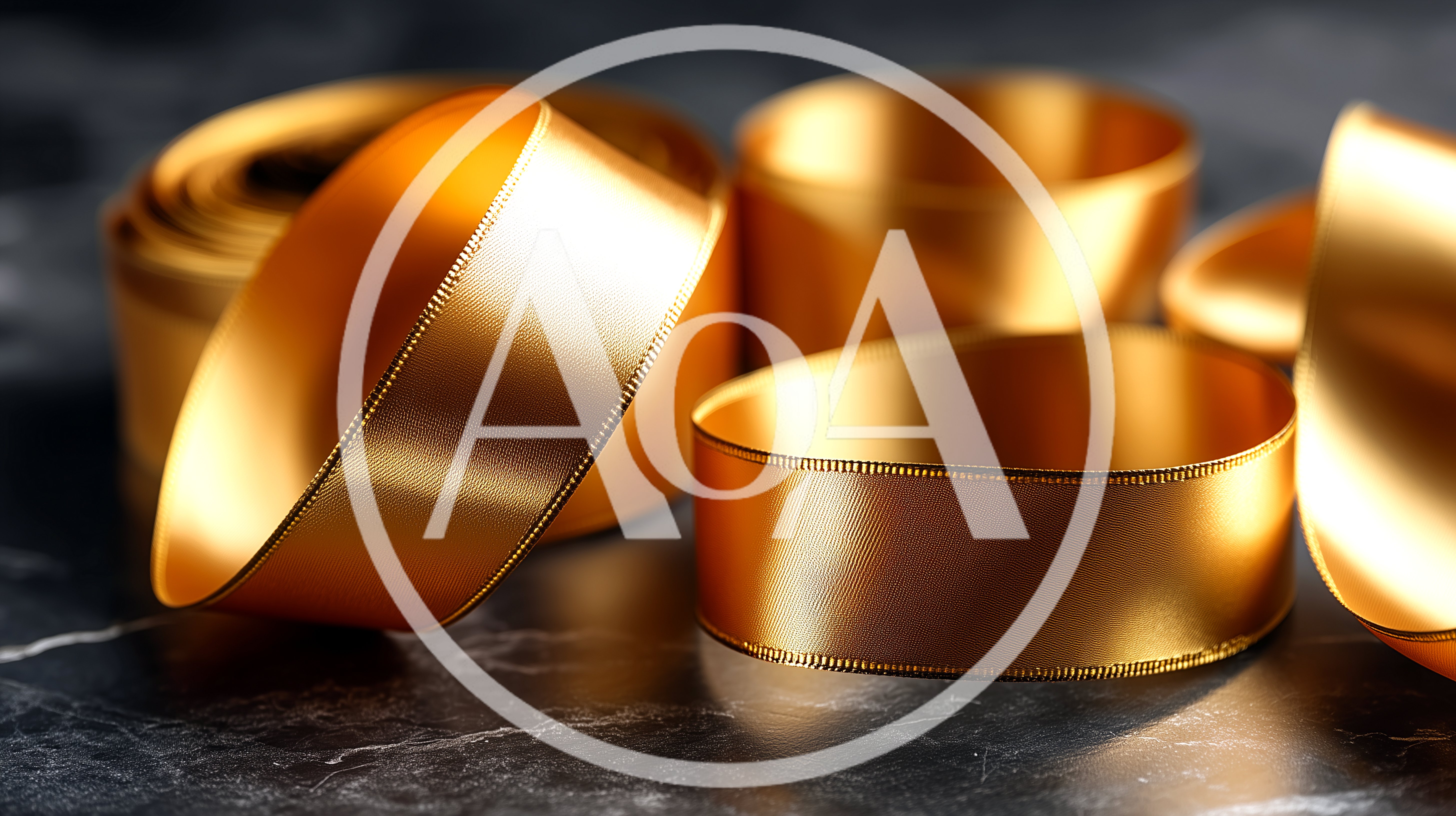 Gold Satin Ribbon Loops on Dark Marble Surface