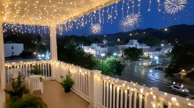 Fireworks Display Over A Small Town At Night