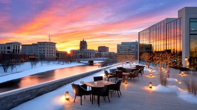 Outdoor Restaurant Terrace Overlooking Snowy River at Sunset