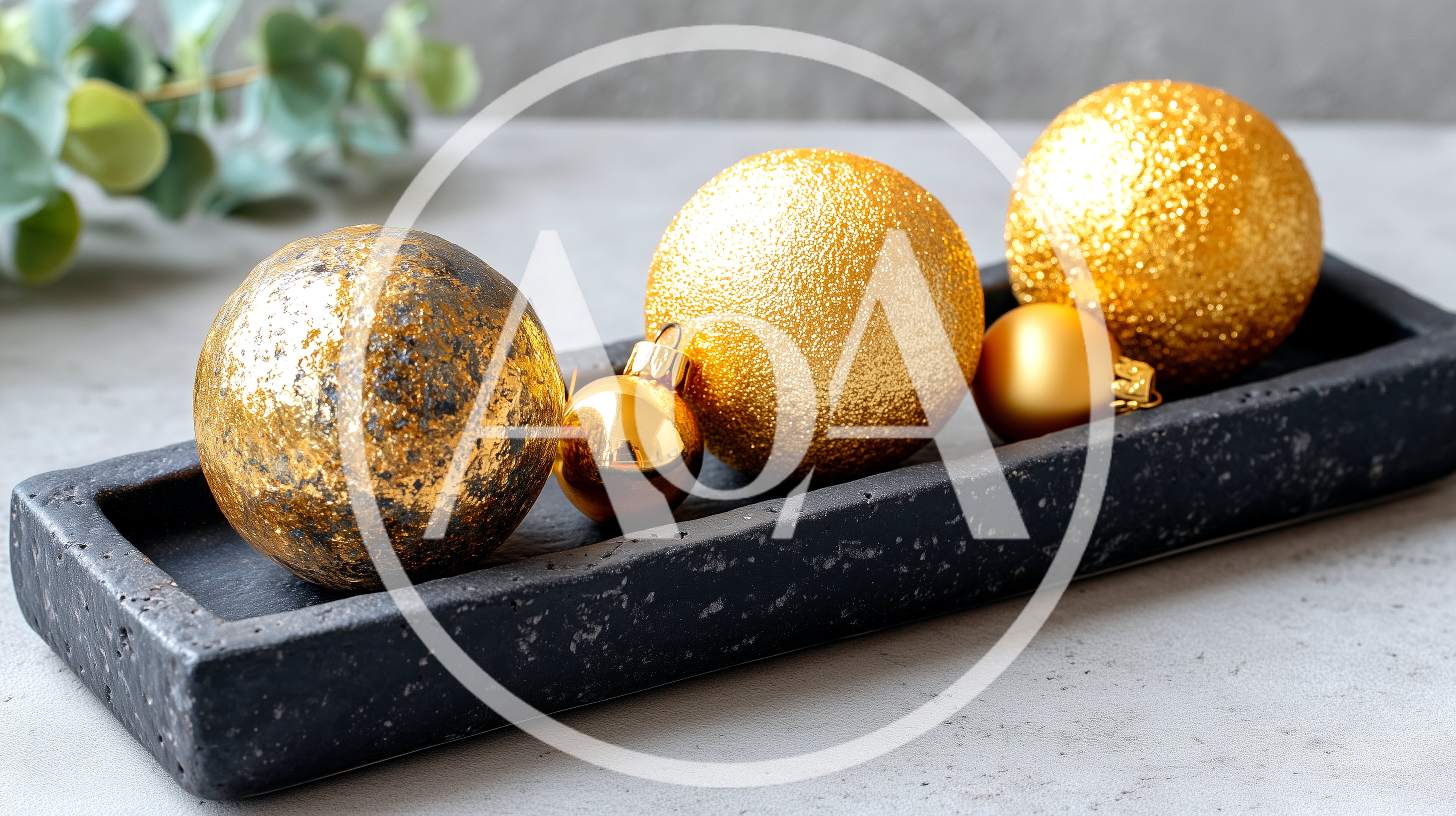 Gold Christmas Ornaments on a Black Concrete Tray