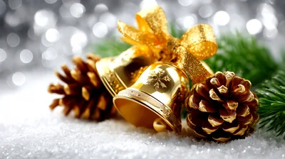 Golden Christmas Bells With Pine Cones On Snow
