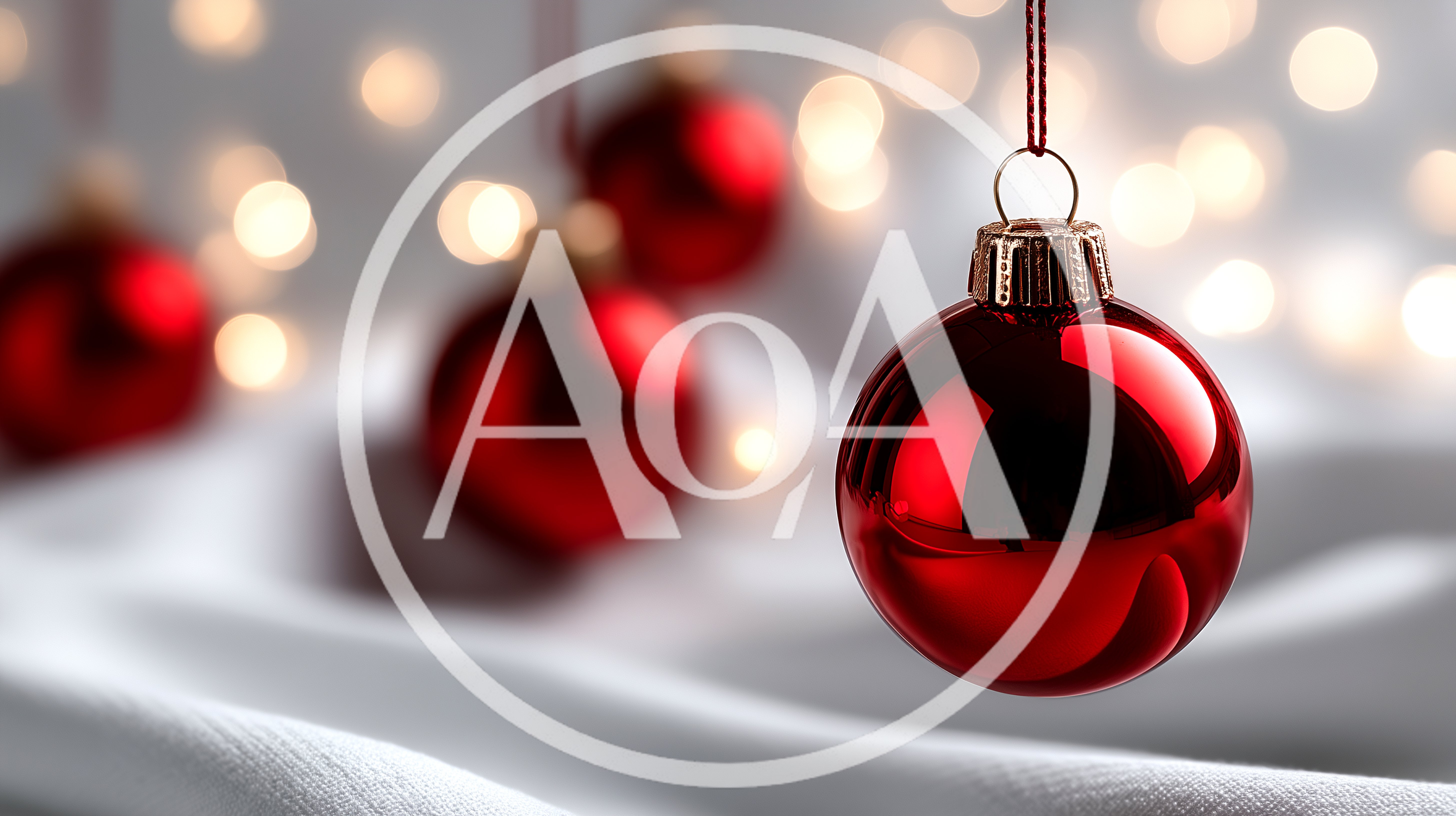 Red Christmas Ornament Hanging Over White Fabric