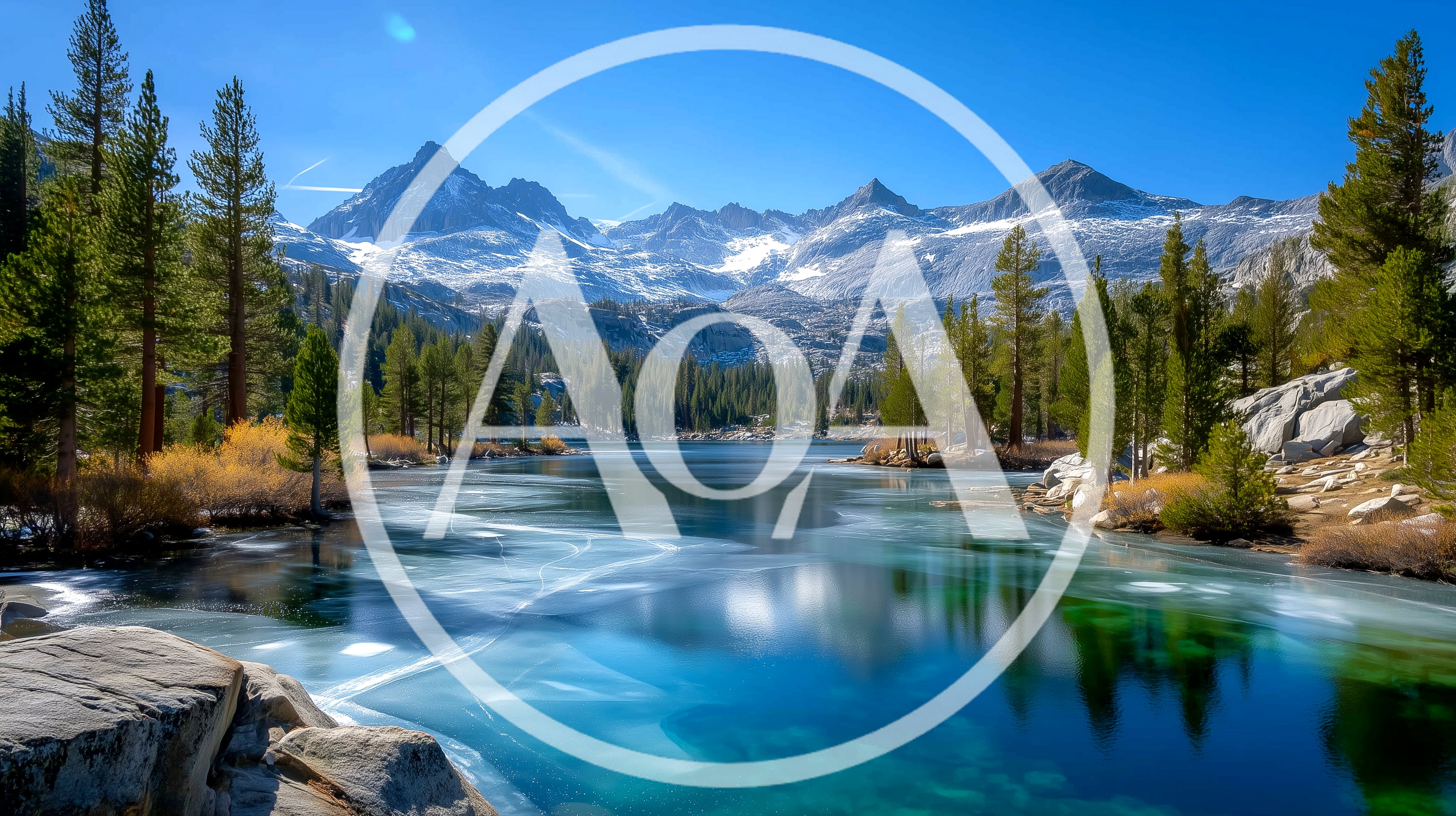 Scenic Alpine Lake With Frozen Surface And Snowy Mountains