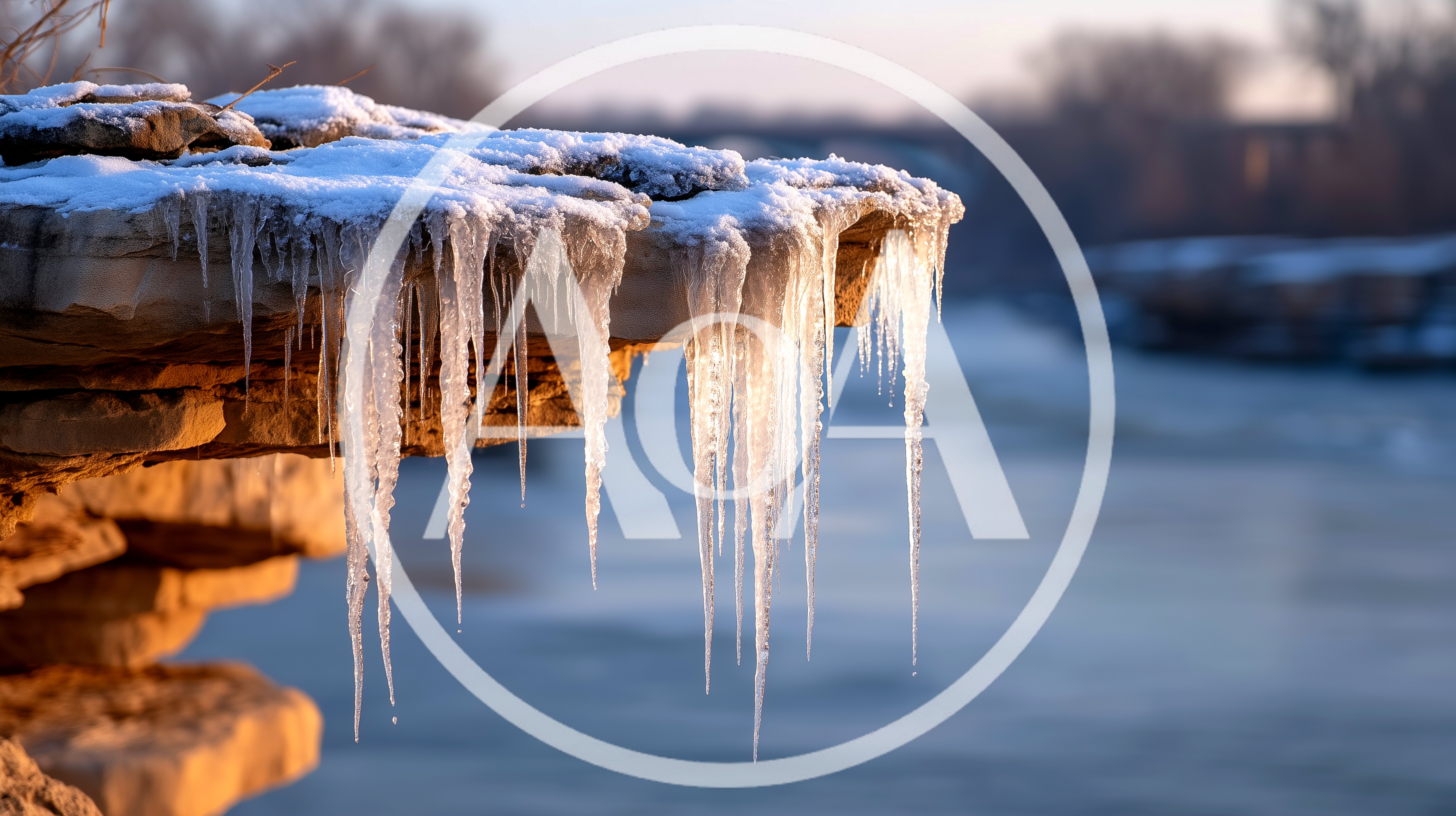 Icicles Hanging From A Frozen Rocky Riverbank