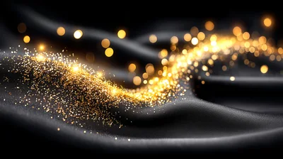 Golden Glitter Particles Flowing Over Black Silk Fabric