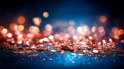 Rose Gold Glitter Particles On Dark Blue Background