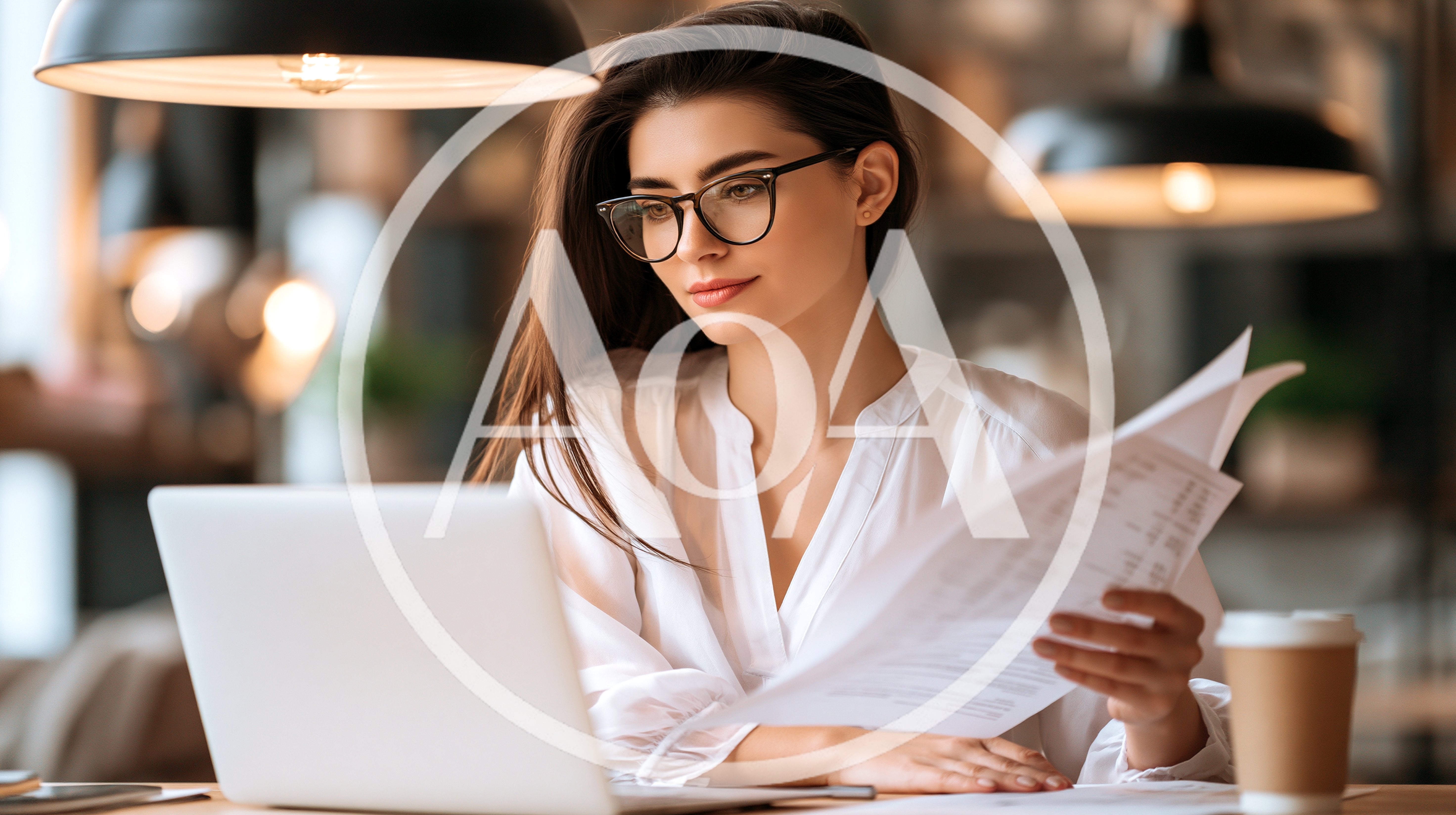 Professional Woman Working On Laptop With Documents