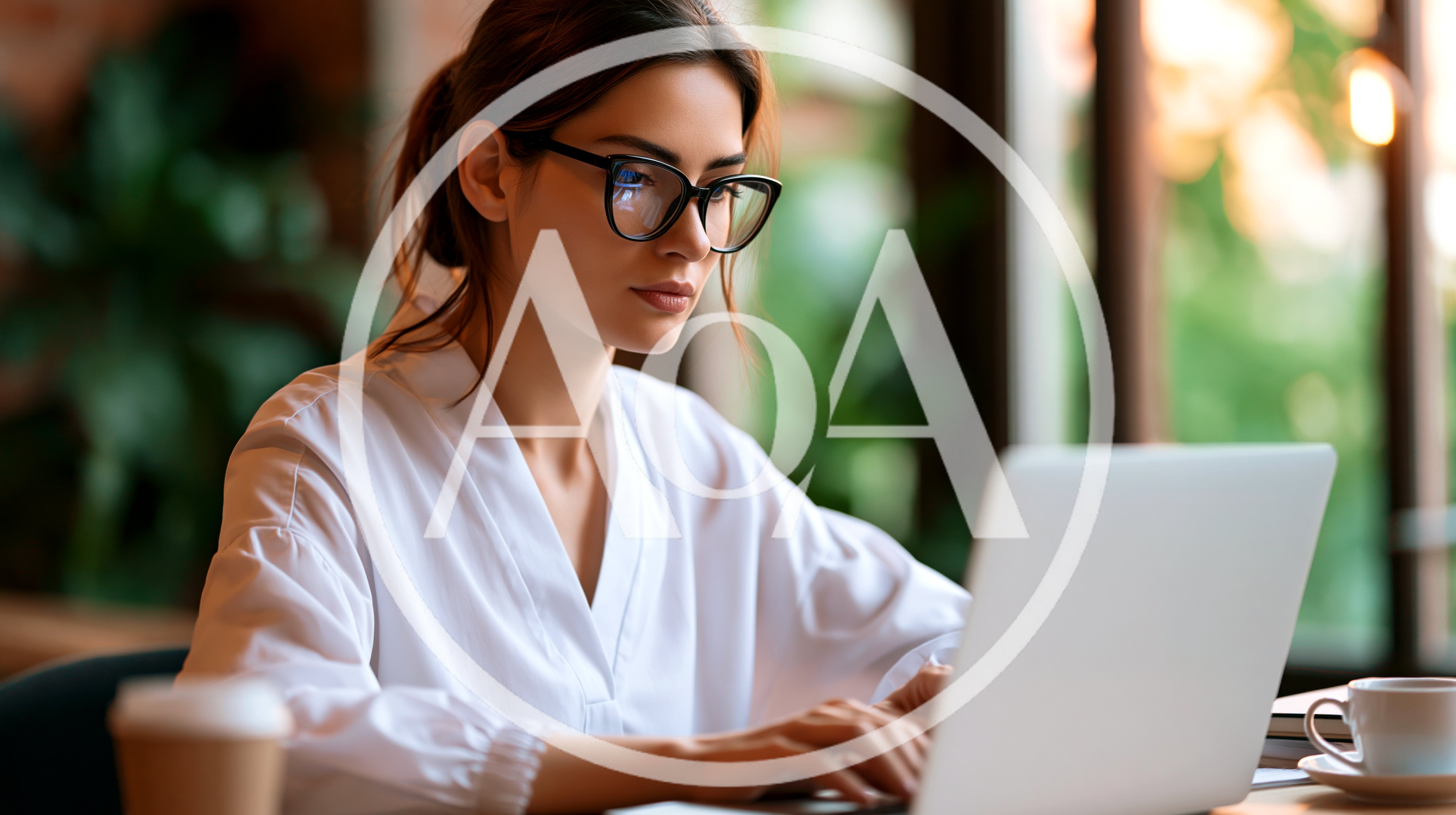 Young Woman Working On Laptop In Modern Office