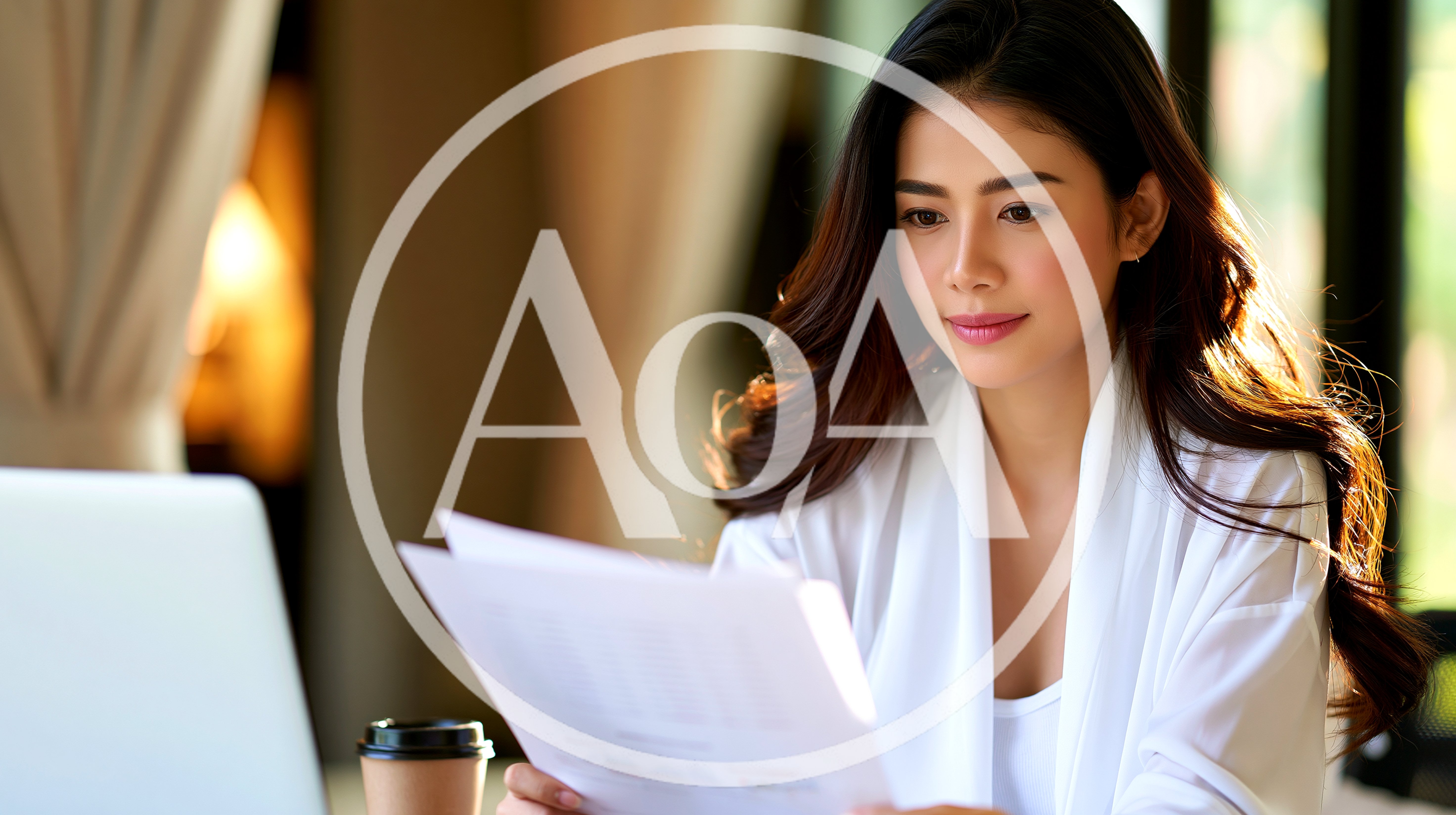 Young Asian Woman Reviewing Documents At Home Office