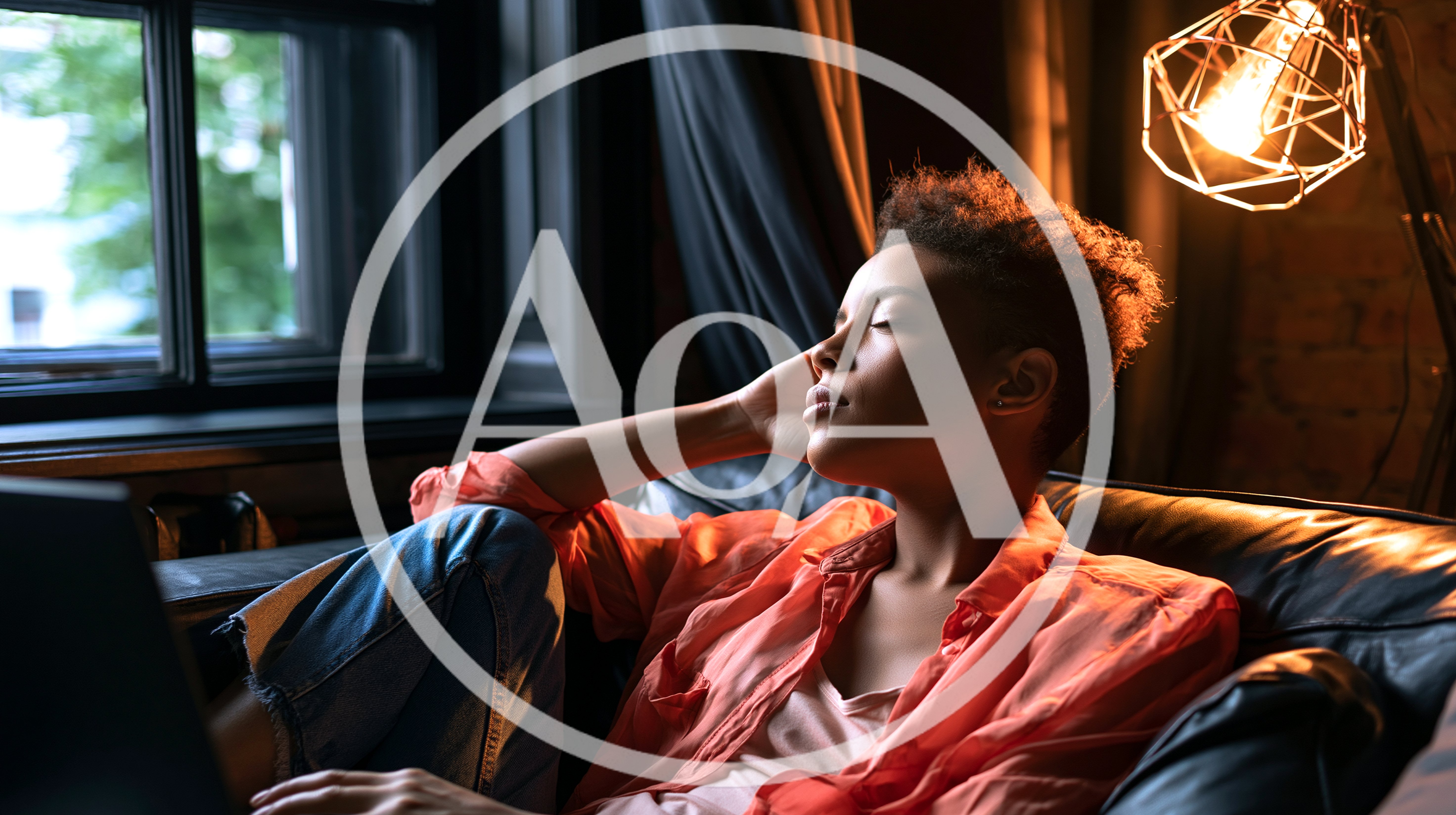 Young Woman Relaxing on Sofa with Laptop