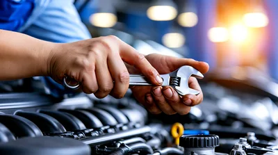 Mechanic Adjusting Adjustable Wrench Over Car Engine