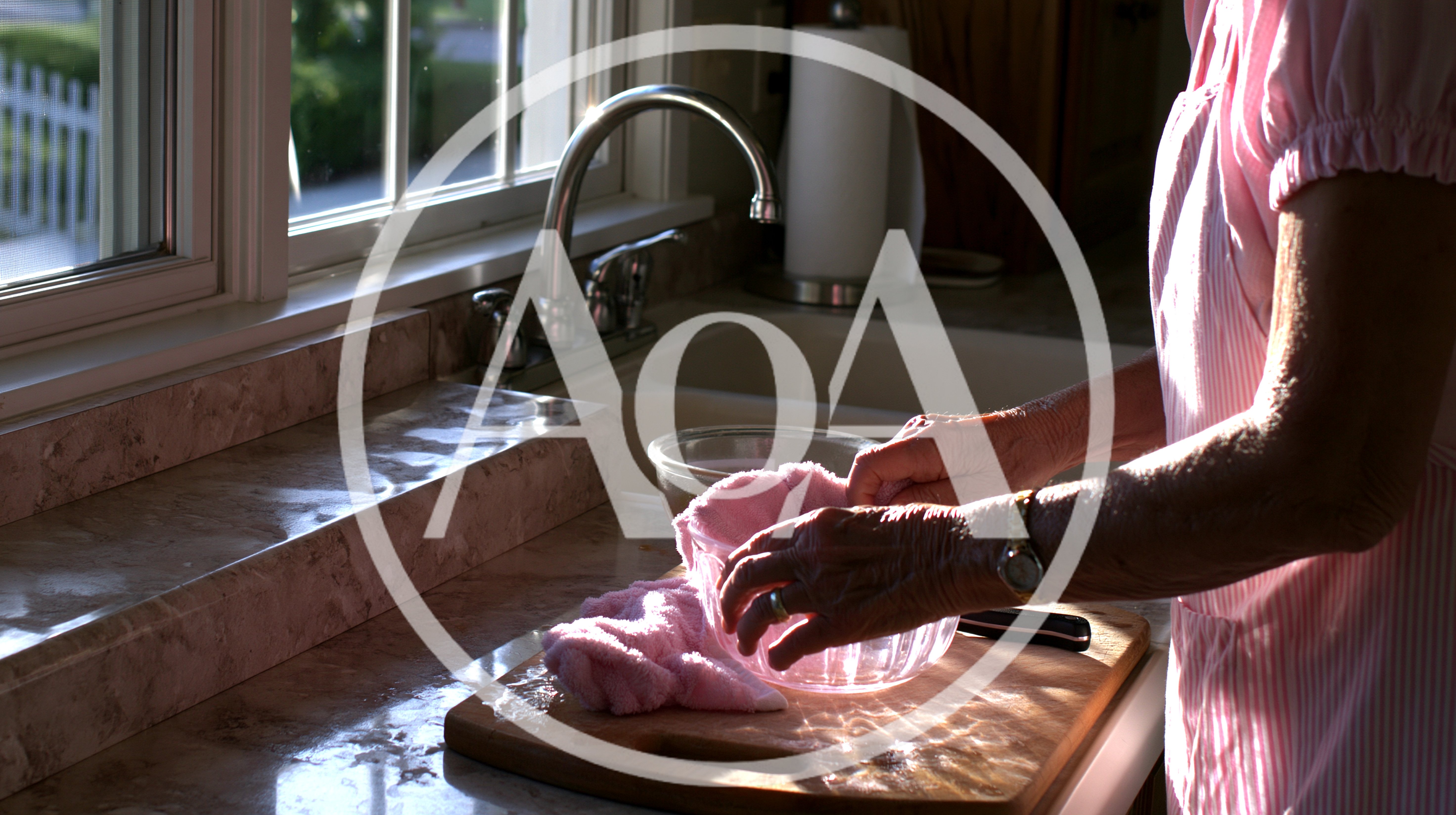 Elderly Woman Preparing Food In A Kitchen