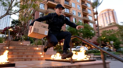 Delivery Driver Jumping Over Fire Pit