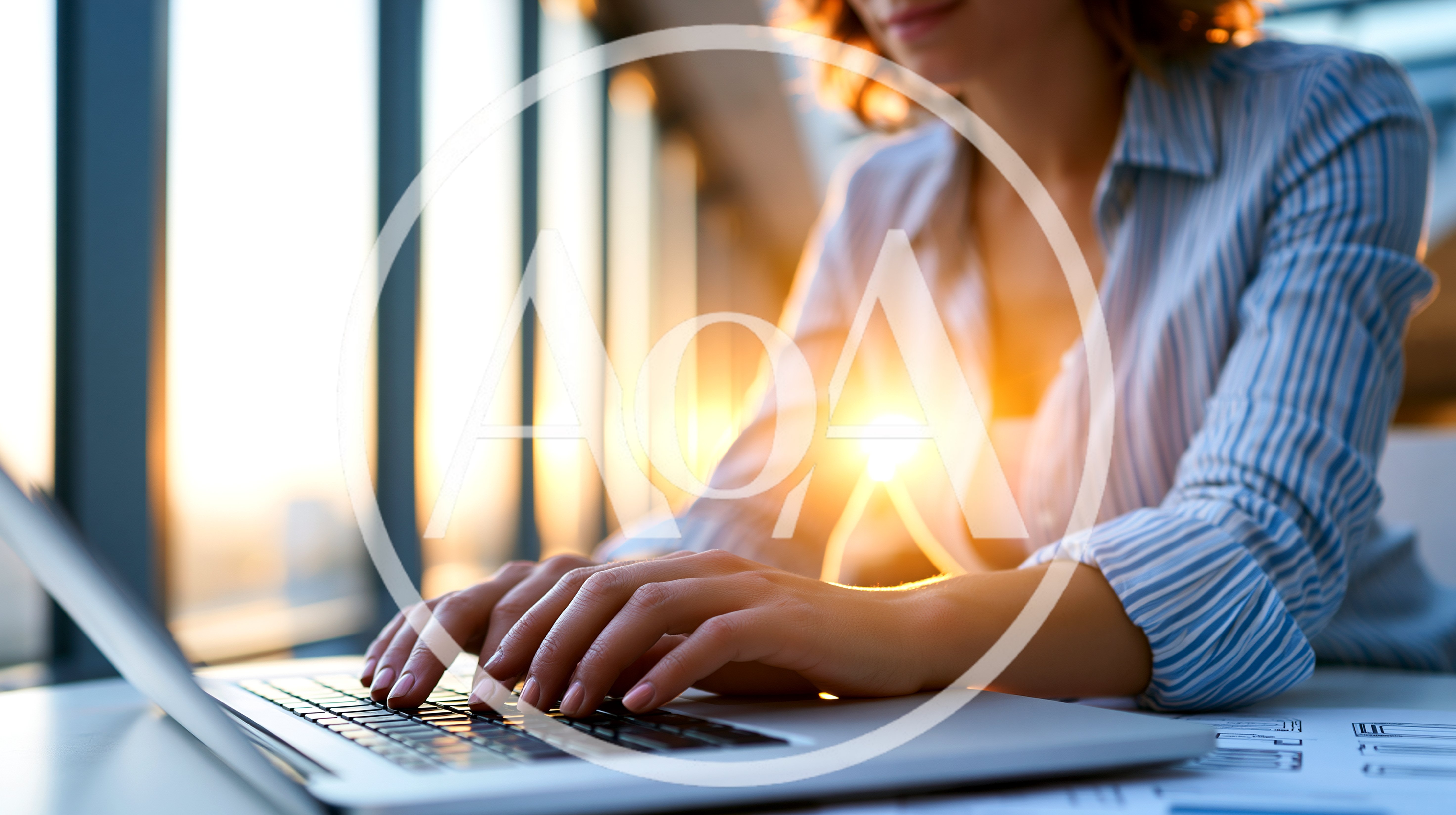Businesswoman Typing On Laptop In Sunny Office