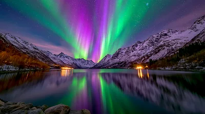 Vibrant Aurora Borealis Over Snowy Mountain Lake